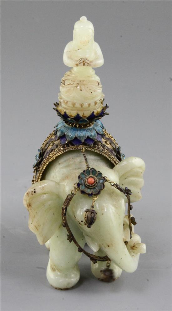 A Chinese celadon jade and filigree work group of Buddha riding an elephant, early 20th century, total height 14.5cm, length 9.8cm